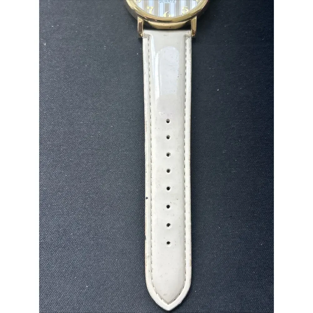 Gold Tone White Band Striped Dial Women’s Quartz Watch